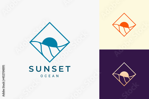 Ocean or surf logo in simple rhombus with wave and sun shape