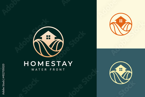 Beach theme resort or villa logo with luxury ocean wave and circle