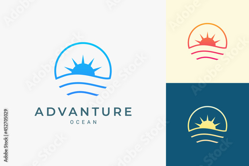 Simple sea or surf logo with ocean wave and sun in circle shape