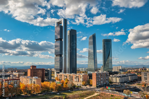 Madrid Spain, city skyline at financial district four towers with autumn foliage season photo