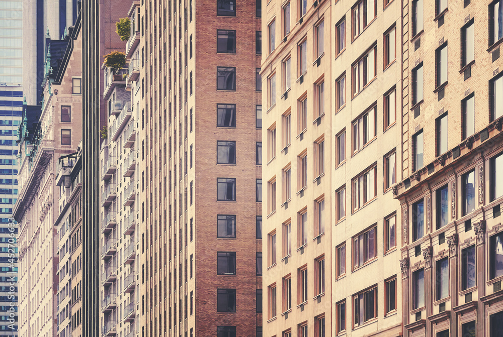 Residential buildings facades, color toning applied, New York City, USA.