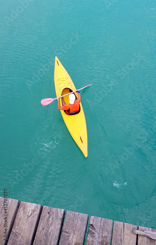 a yellow canoe in the blue lake