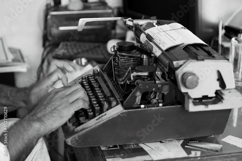 Photos Typist working on Typewriter still in use