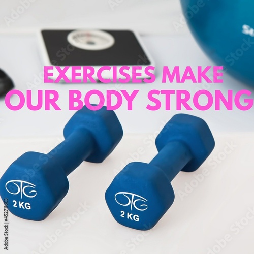 Exercises make our body strong and healthy is written on dumbel background. photo