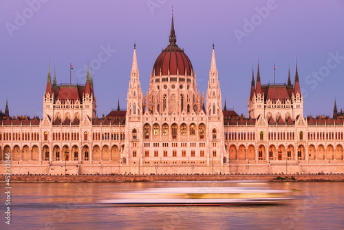 Budapest, Hungary. A classic view of the historic parliament building. Danube River and Parliament during sunset. A ferry trip on the Danube River.