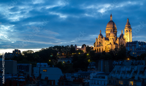 The Sacre-Coeur in Paris under a beautiful sunset sky, from a unique point of view