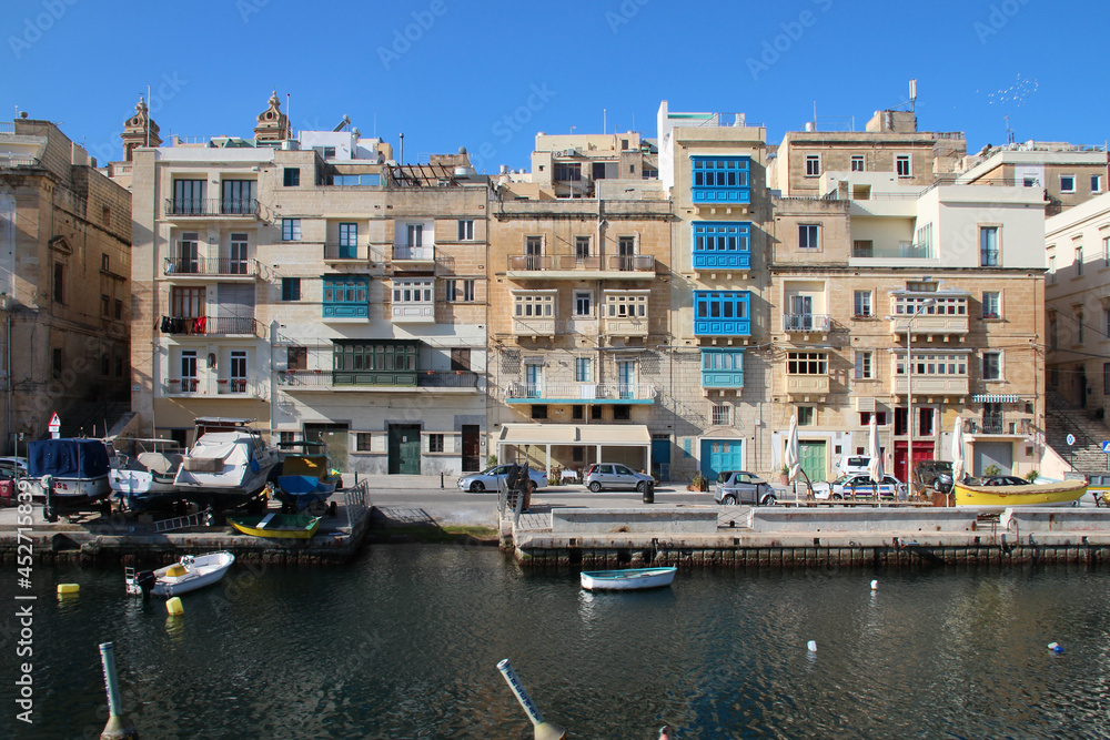 flat buildings and quay in senglea in malta 