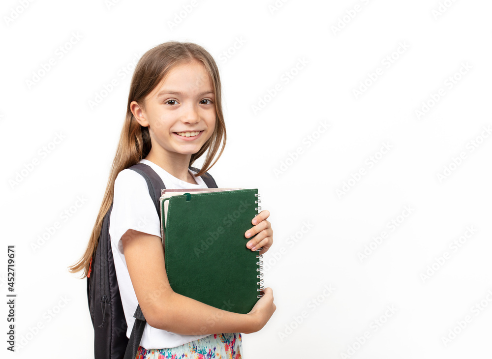 Portrait of smiling school girl child with school bag and books. isolated on a white background. Portrait of smiling school girl child with school bag and books. isolated on a white background.