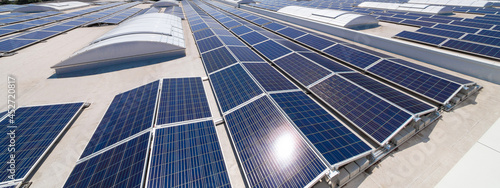 solar panels on top of a big factory. photo