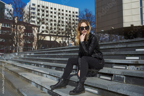 woman in leather jacket near building outdoors vacation summer