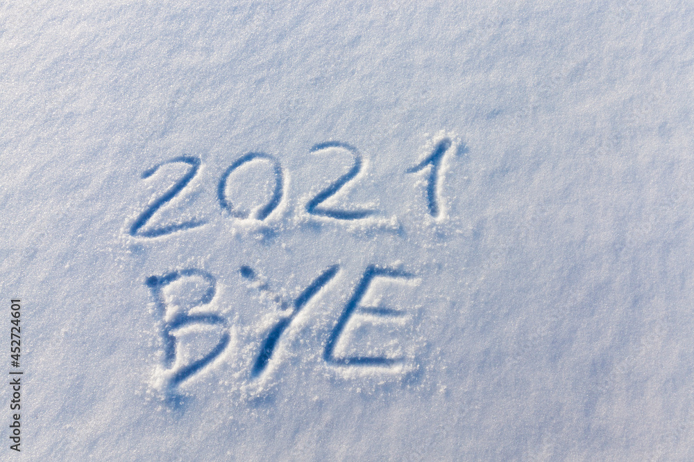 the inscription about the new year 2022 on the snow in winter the inscription about the new year 2022 on the snow in winter