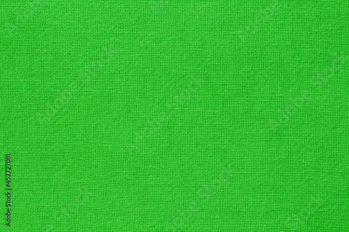 Green lime cotton fabric cloth texture for background, natural textile pattern.