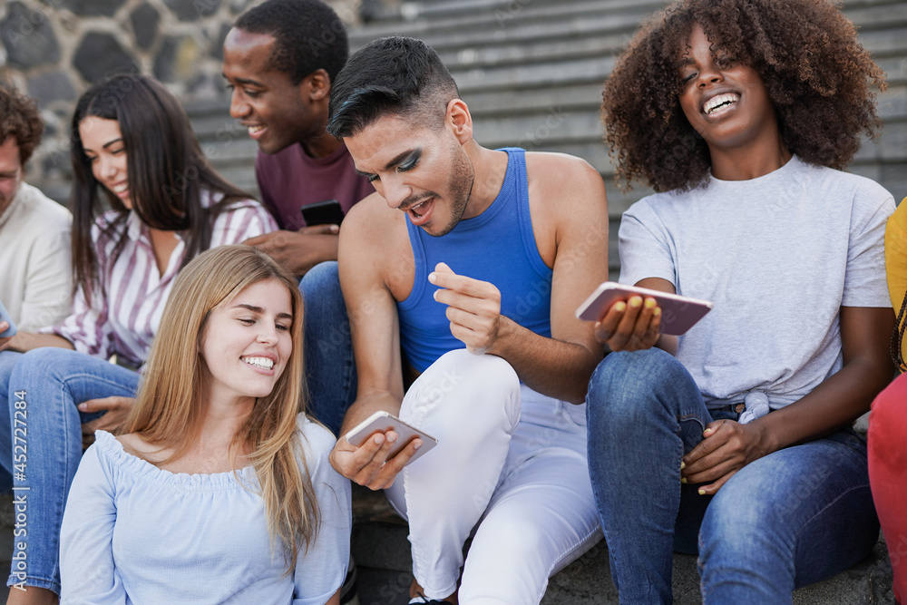 Group of young diverse friends using mobile phone in the city - Multiracial people having social moment and enjoy technology
Group of young diverse friends using mobile phone in the city - Multiracial people having social moment and enjoy technology