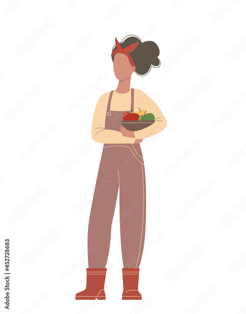 Fototapeta premium Stylish woman with a basket of apples in her hands. Cute cartoon girl in rubber boots and overalls isolated on a white background.