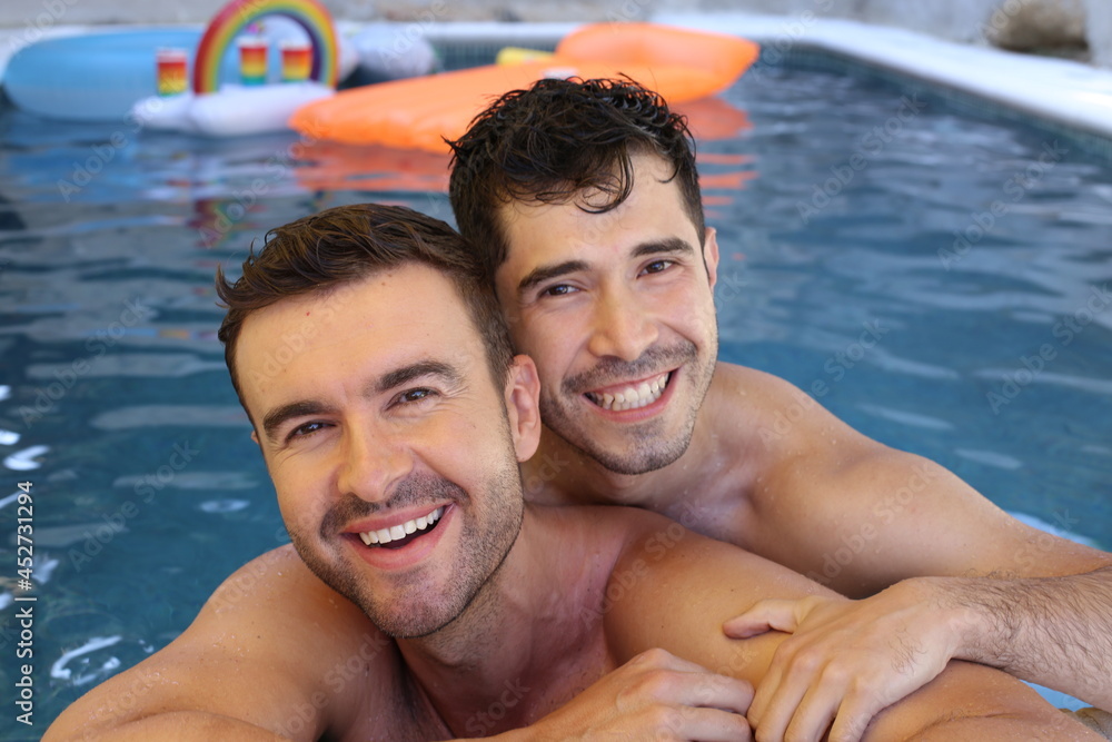 Gorgeous interracial gay couple in swimming pool Gorgeous interracial gay couple in swimming pool