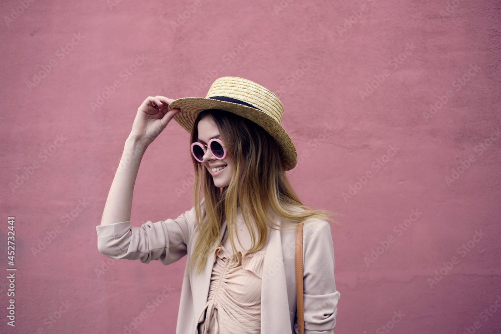 woman in fashionable clothes near the wall outdoors walking street style woman in fashionable clothes near the wall outdoors walking street style