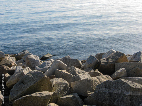 Rocks and sea in the harbor of Dun Laoghaire, Dublin © rninov