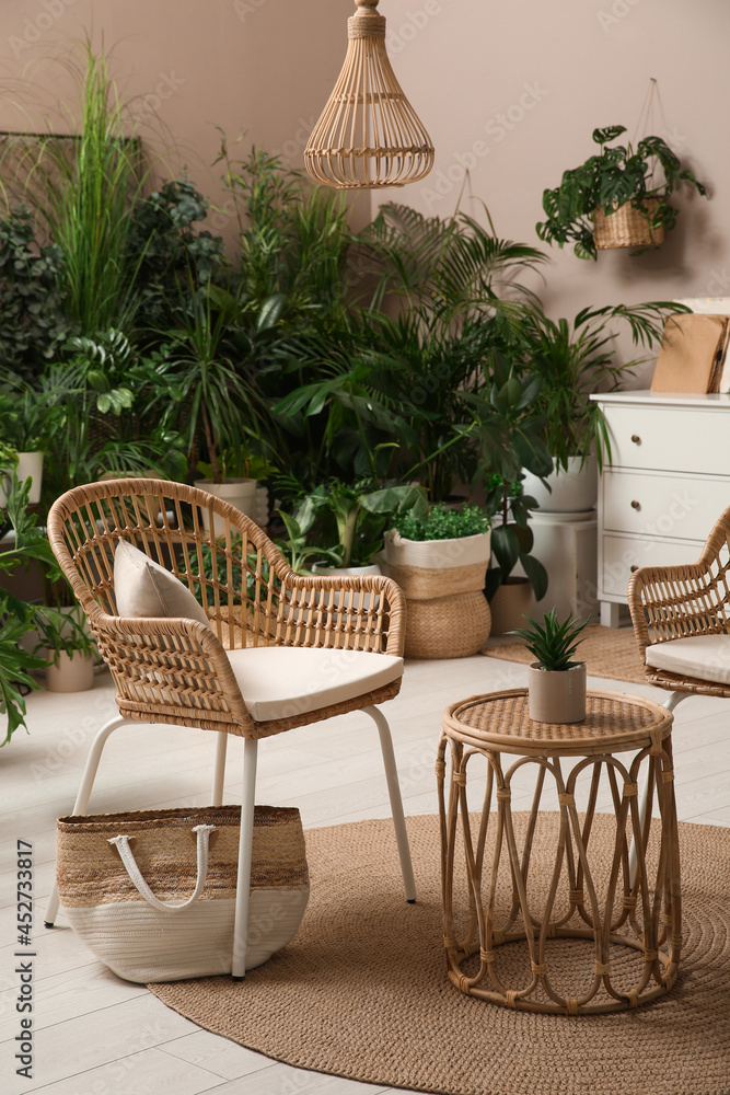 Room interior with stylish furniture and different houseplants Room interior with stylish furniture and different houseplants
