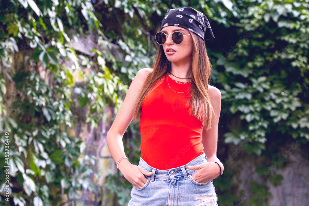 woman with modern street style clothes pose for pictures woman with modern street style clothes pose for pictures