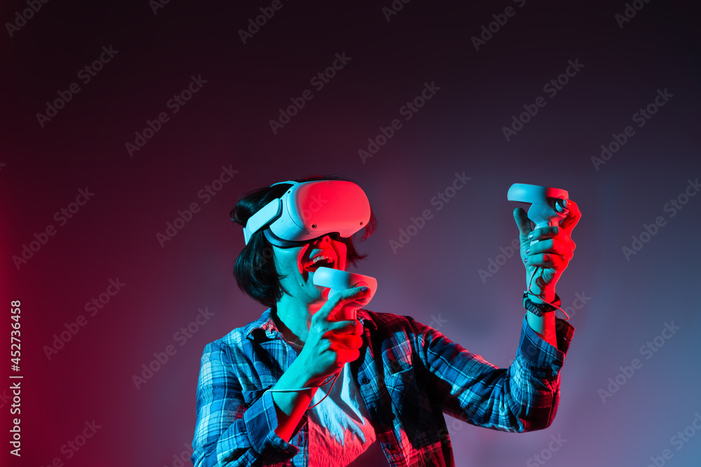 Fototapeta premium Woman action in virtual reality helmet. VR glasses, technology concept