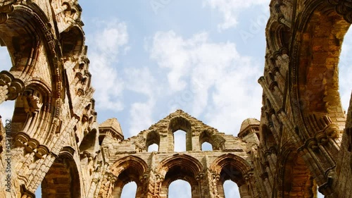 Cinematic View of the ruins of Whitby Abbey, a 7th-century Christian monastery and Benedictine abbey in Yorkshire, England, UK