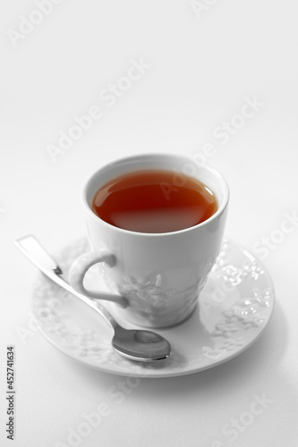 Wallpaper Mural Close up view of white porcelain cup of tea on white background Torontodigital.ca