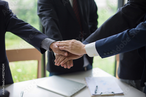 Wallpaper Mural business group Start doing business together by holding hands symbolizing strong teamwork and succeed Torontodigital.ca
