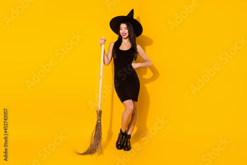 Fotografi Full body photo of funny witch young lady with broom wear black dress cap shoes