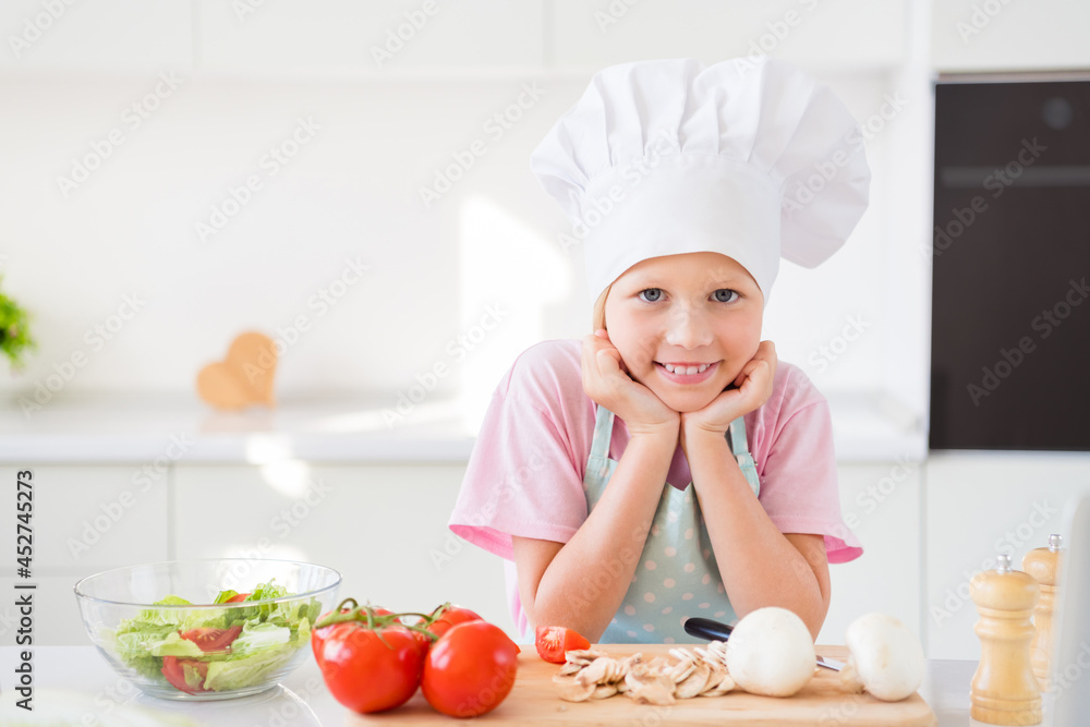 Photo of young little girl happy positive smile cook cuisine healthy meal ingredients supper indoors Photo of young little girl happy positive smile cook cuisine healthy meal ingredients supper indoors