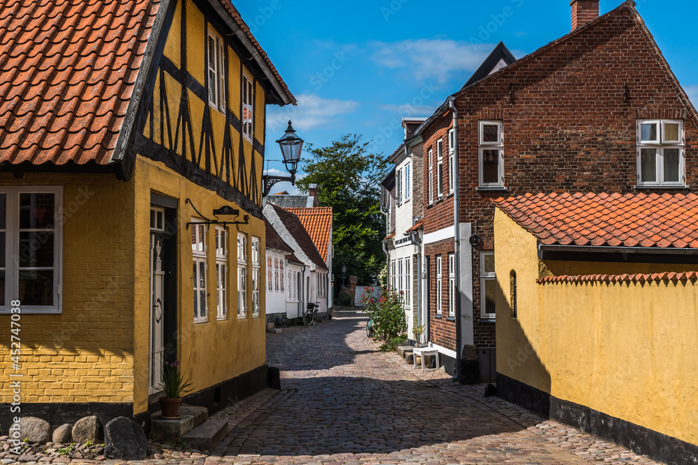 Ribe, Denmark - August 4, 2021: A small street in Denmark's oldest city Ribe