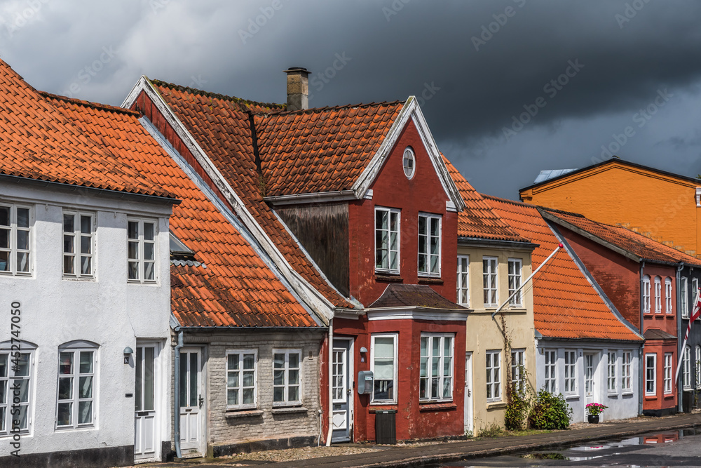 Tonder, Denmark - August 10, 2021: beautiful old houses in a small street at a very rainy day