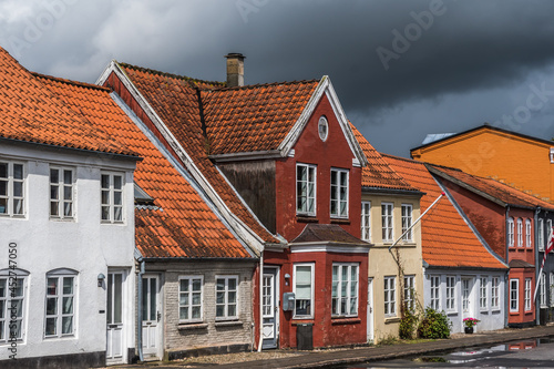 Tonder, Denmark - August 10, 2021: beautiful old houses in a small street at a very rainy day