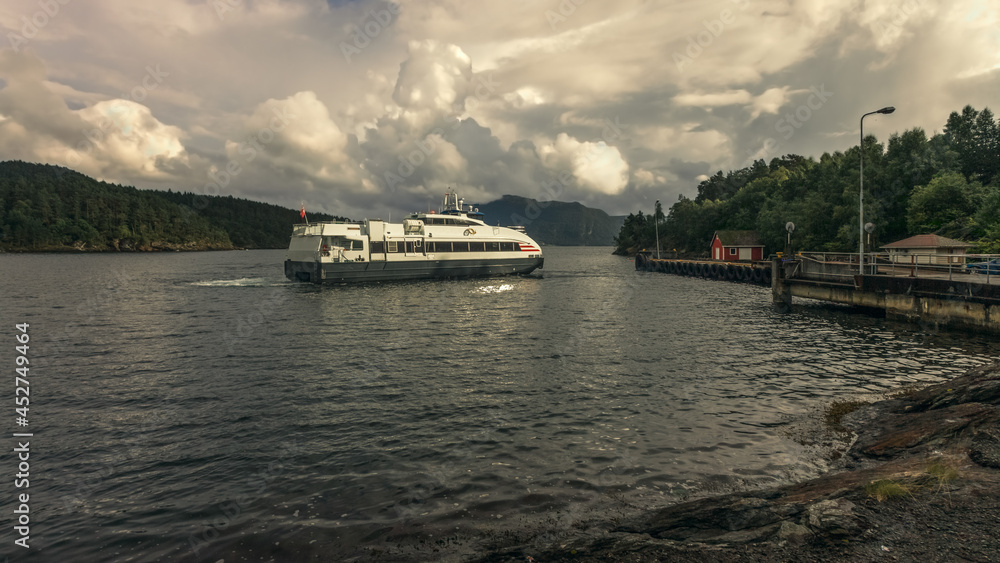 A passenger ferry approaches the pier.Norway.