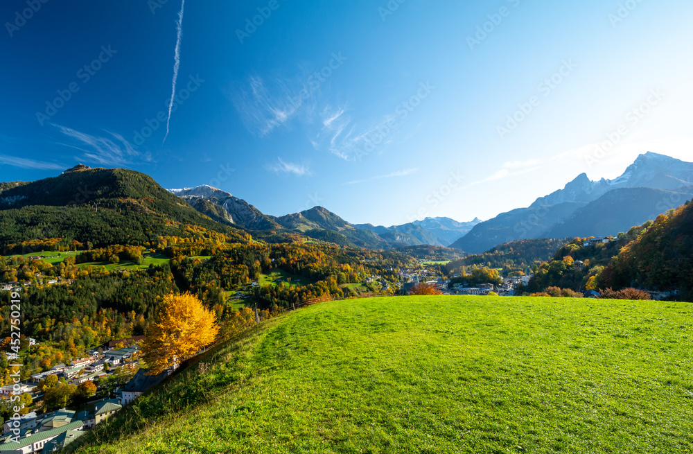 beautiful view on alpine town Berchtesgaden with green meadow during fall , Bavaria , Germany
