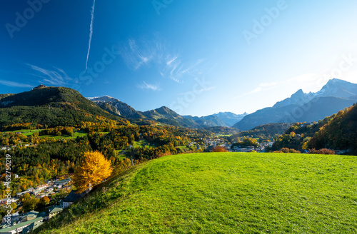 Obraz na płótnie beautiful view on alpine town Berchtesgaden with green meadow during fall , Bavaria , Germany w salonie