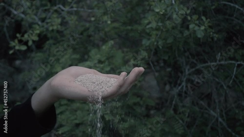 Person Blowing Sand in Slow Motion