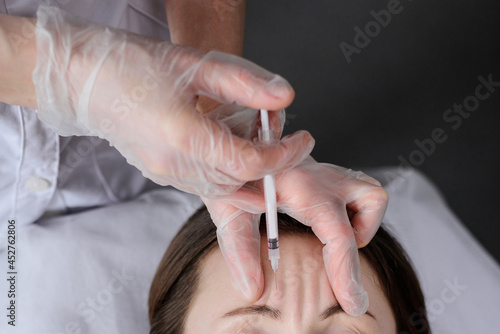 Face Injection. Facial Skincare Biorevitalization Treatment. Woman Getting Cosmetic Procedure By Beautician In Salon. photo