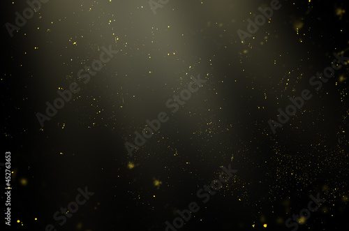 golden particles in the rays of light on a black background for use with the screen overlay mode