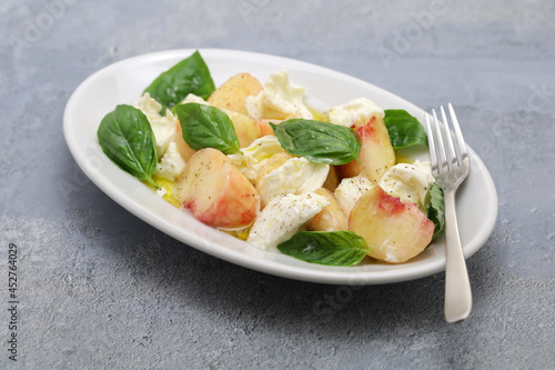 peach caprese salad; flat peach, mozzarella and basil