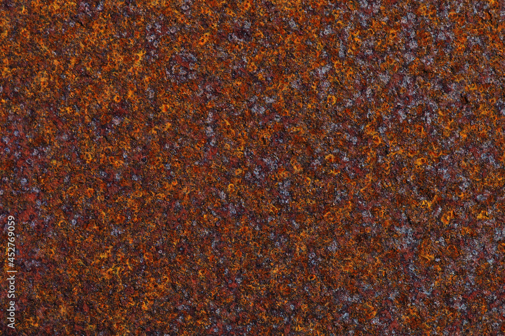 Dark rusty iron surface. Textured background or wallpaper. Industrial production and scrap metal. US rusty belt. Corroded backdrop. Close up Dark rusty iron surface. Textured background or wallpaper. Industrial production and scrap metal. US rusty belt. Corroded backdrop. Close up
