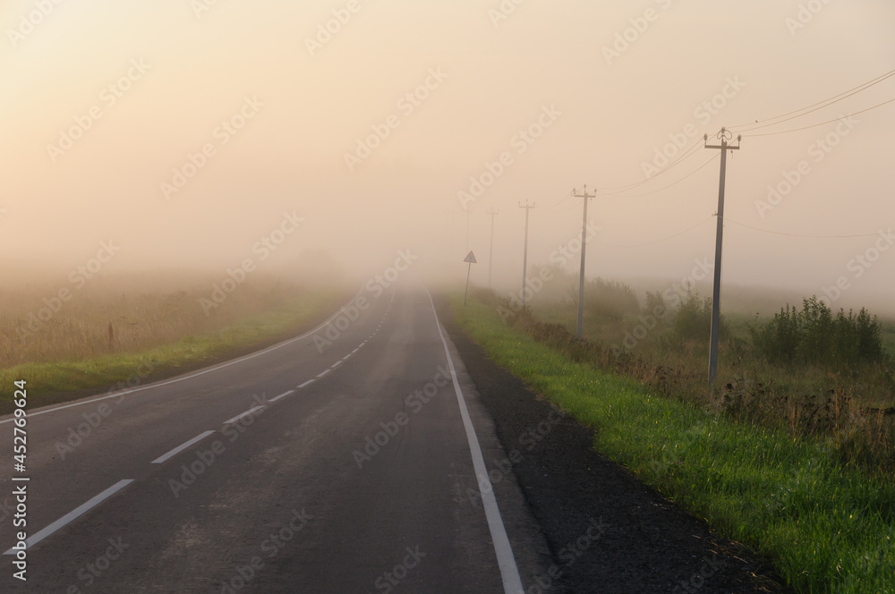 Landscape overlooking a foggy road