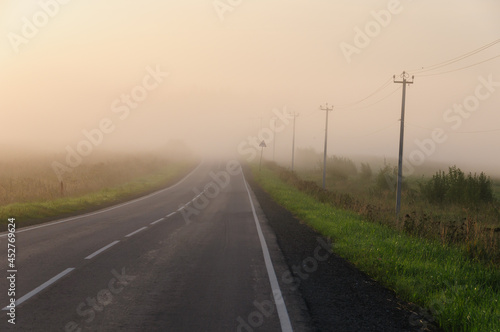 Landscape overlooking a foggy road
