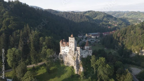Wallpaper Mural Majestic Bran Castle on hilltop, aerial pan; Transylvania, Romania Torontodigital.ca