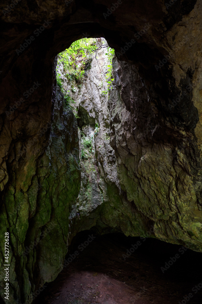 The upper opening from the green plant cave.