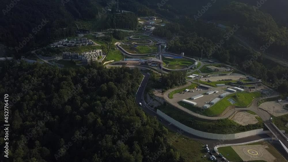 aerial view of the Olympic bobsleigh (2014) complex at the Rosa Khutor ski resort (Sochi, Russia) on a sunny summer day aerial view of the Olympic bobsleigh (2014) complex at the Rosa Khutor ski resort (Sochi, Russia) on a sunny summer day