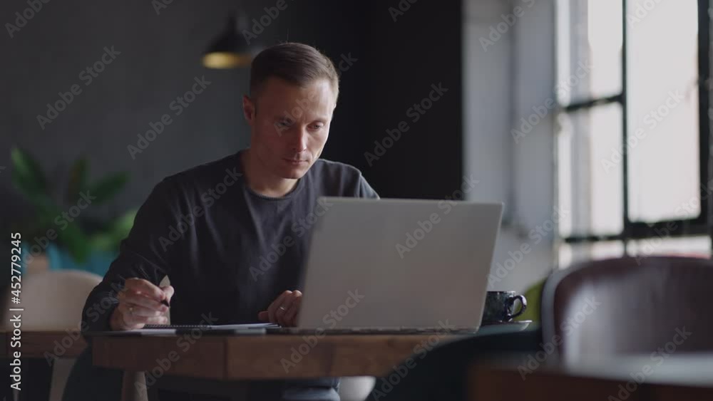 Hispanic latin man college student using laptop computer watching distance online learning seminar class, remote university webinar or having virtual classroom meeting in university creative space. Hispanic latin man college student using laptop computer watching distance online learning seminar class, remote university webinar or having virtual classroom meeting in university creative space.
