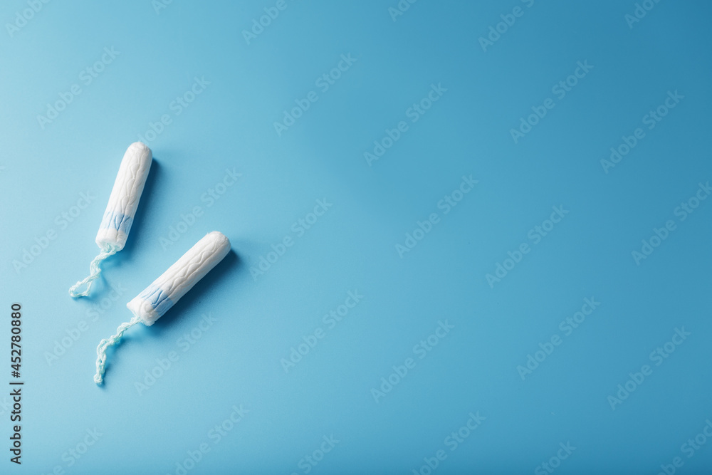Gynecological tampons on a blue background free space Gynecological tampons on a blue background free space