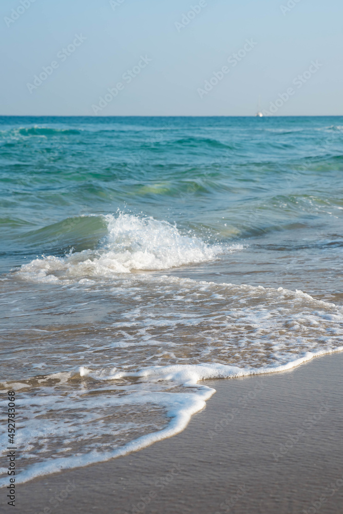Sea or ocean tropical landscape view. Sea waves under the sun. Summer vacation and travel concept. Water wave surface. Sand beach. Sea or ocean tropical landscape view. Sea waves under the sun. Summer vacation and travel concept. Water wave surface. Sand beach.
