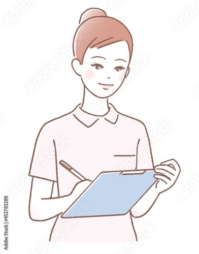 カルテを書く若い看護師