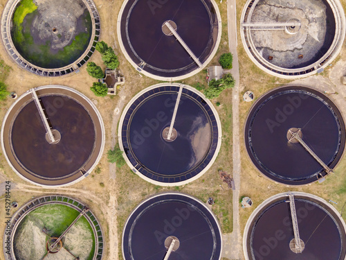 Round wastewater cleaning reservoirs at a sewage treatment facility. Grey water recycling, aerial view